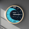 Tidal Timepieces' Blue Room tide clock hanging on a wall.