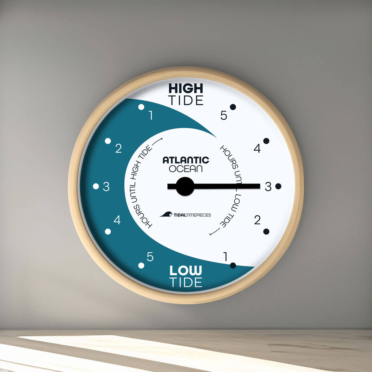 Tidal Timepieces' Coastal Daybreak tide clock hanging on a wall.