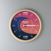 Tidal Timepieces' Oceanic Sunrise tide clock hanging on a wall.