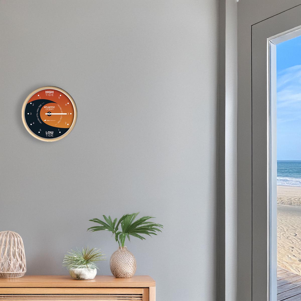 Tidal Timepieces Sunburst Swell tide clock in an entryway of a coastal home.