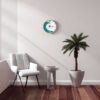 The Tidal Timepiece's Aqua Horizon tide clock hanging in a mid-century modern designed room.