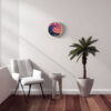 The Tidal Timepiece's Oceanic Sunrise tide clock hanging in a mid-century modern designed room.