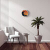 The Tidal Timepiece's Sunburst Swell tide clock hanging in a mid-century modern designed room.