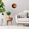 The Tidal Timepiece's Sunburst Swell tide clock hanging in a mid-century modern designed room.